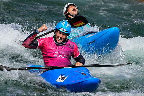 Joseph Clarke reacts to willing silver in men's kayak cross finals 